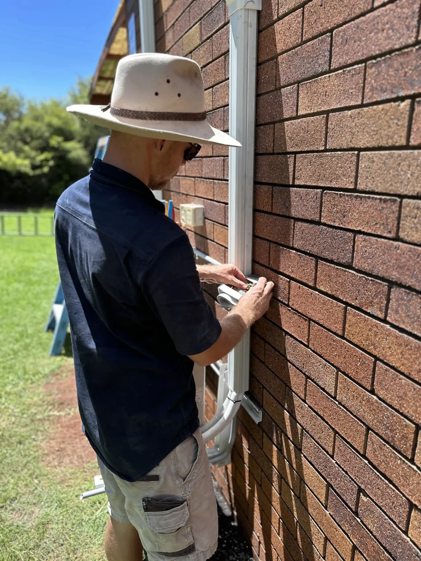 Glenn working on ceiling electrical installation