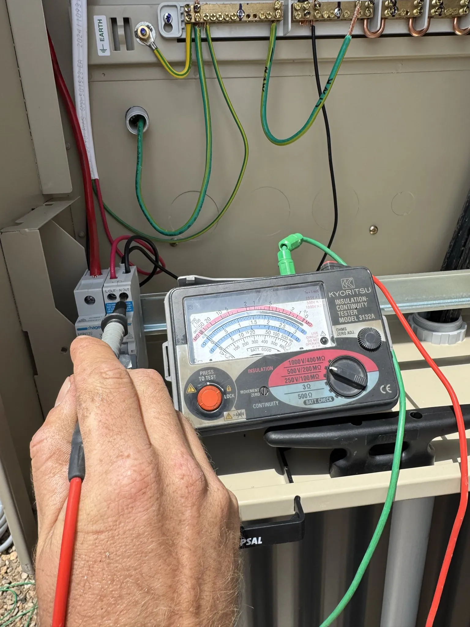 Electrician performing insulation resistance testing
