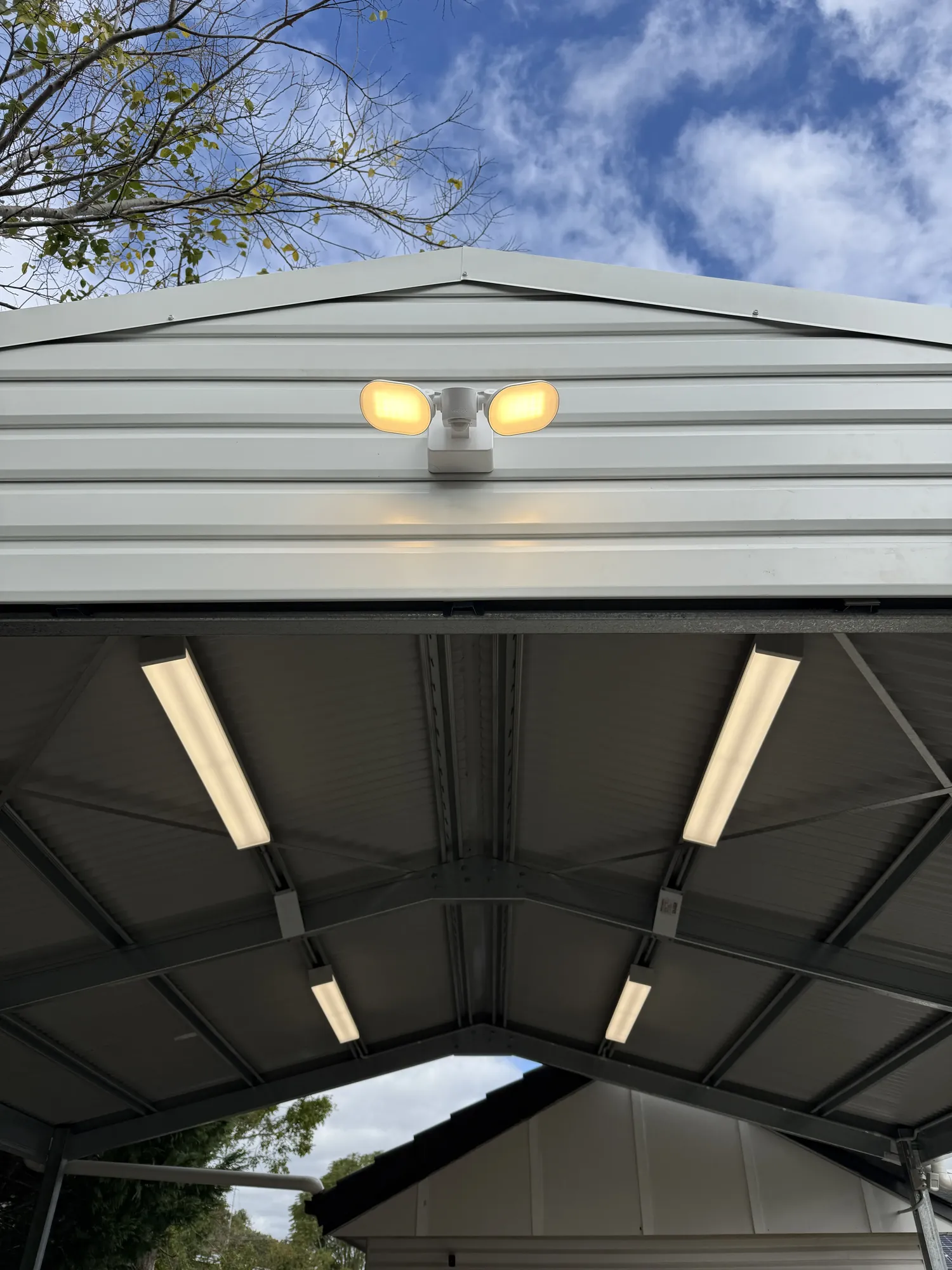 Exterior flood lights and LED battens at shed entrance