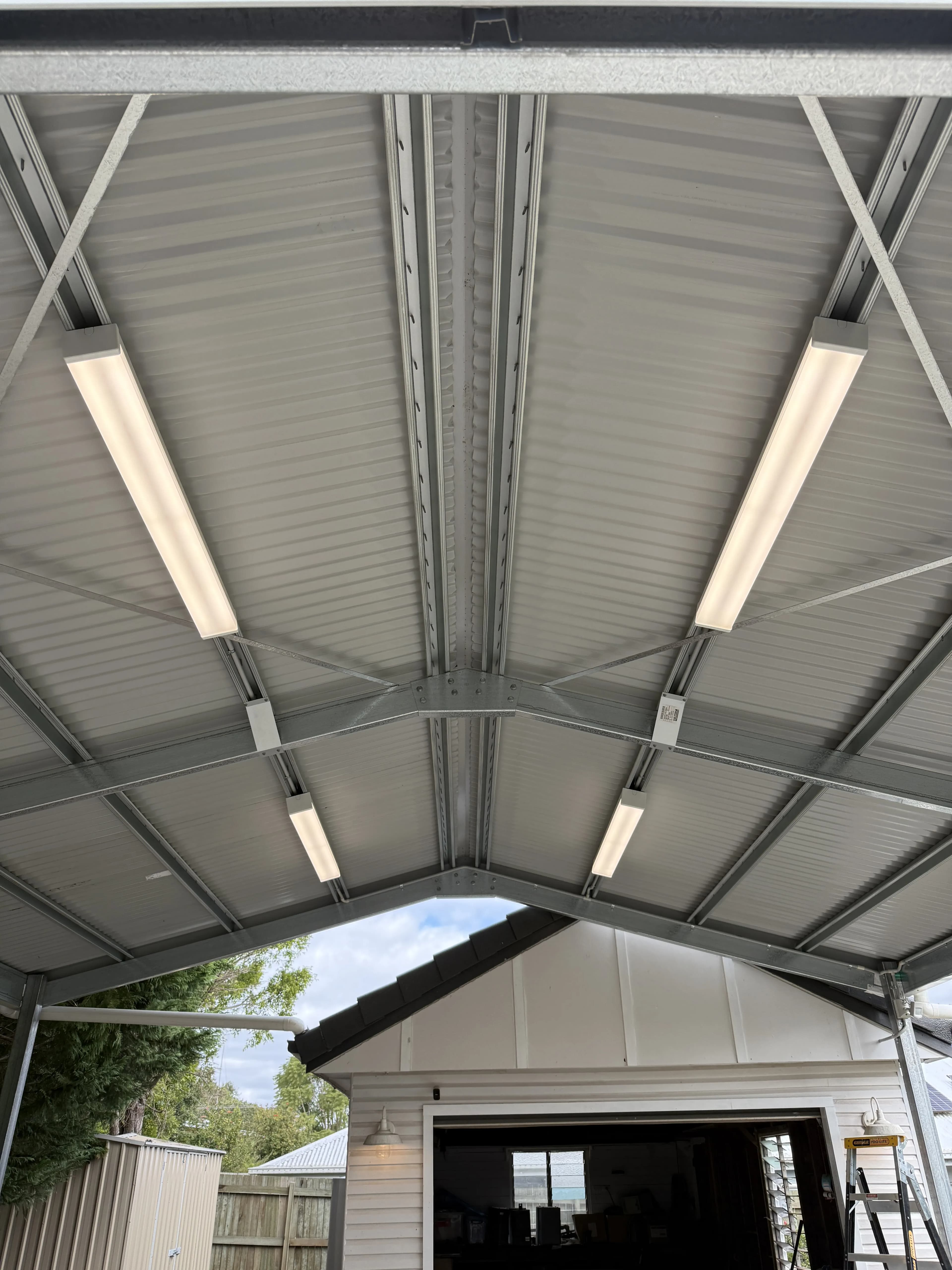 LED batten lights mounted on exterior shed wall