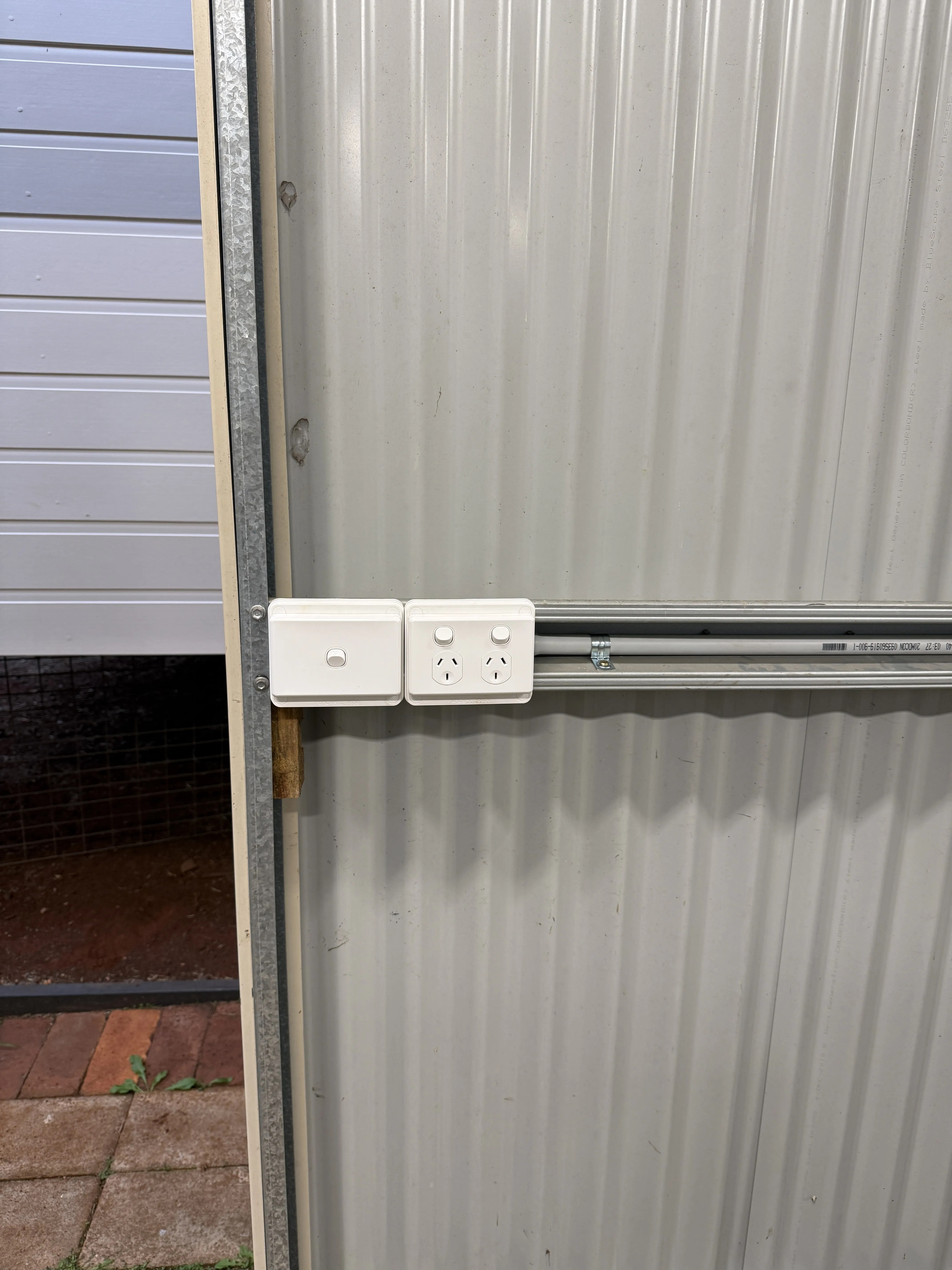 Stacked double power points on shed wall