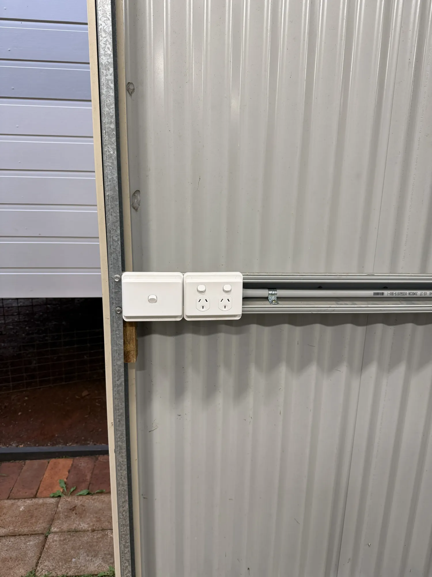 Stacked double power points on shed wall